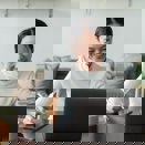 Woman smiling to her laptop