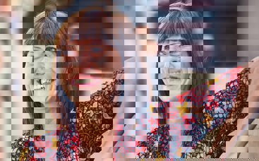 Woman smiling with red top